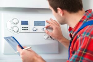 Technician working on a thermostat.